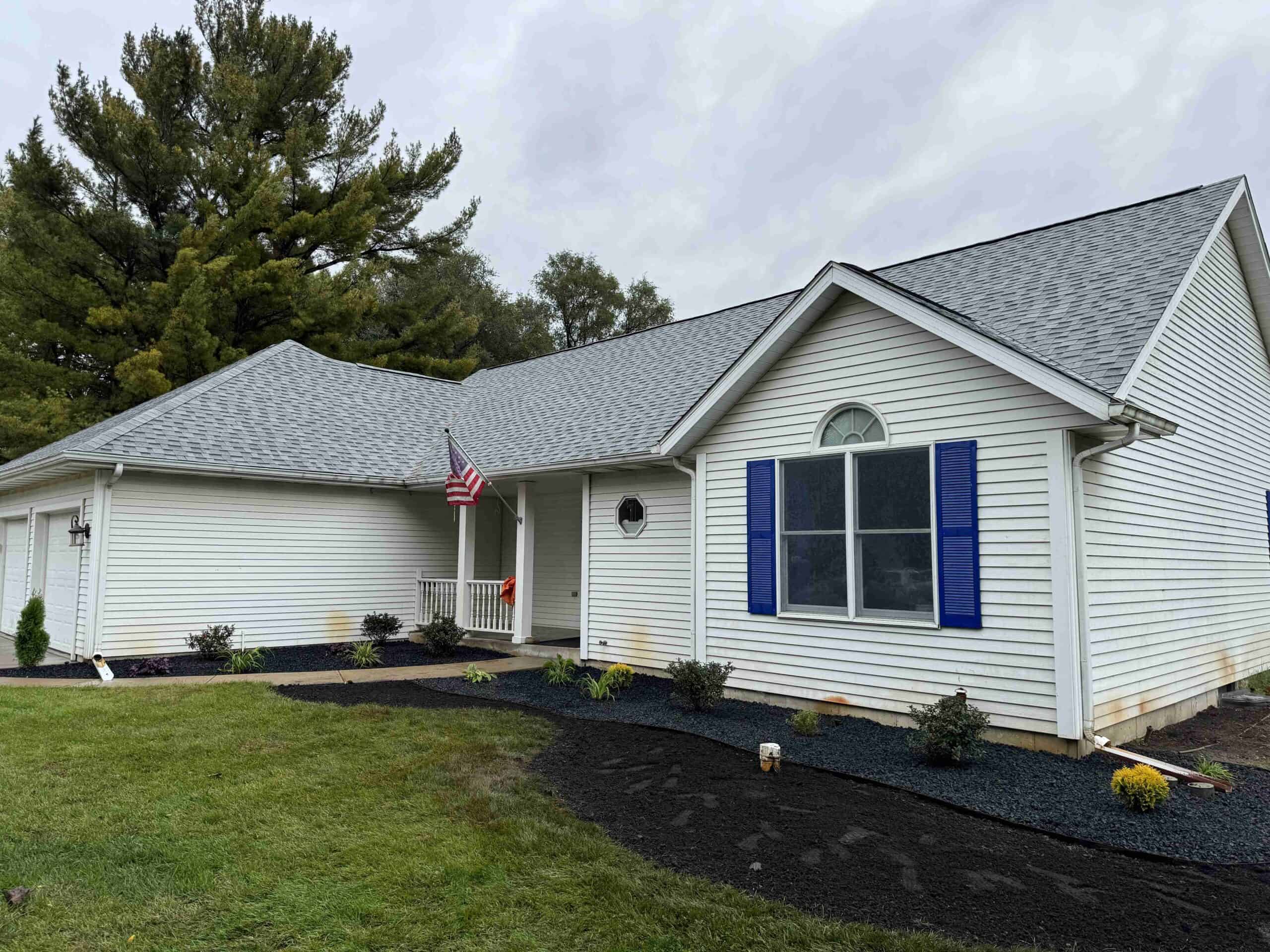 Old mulch has been replaced with fresh mulch for this home to increase curb appeal.