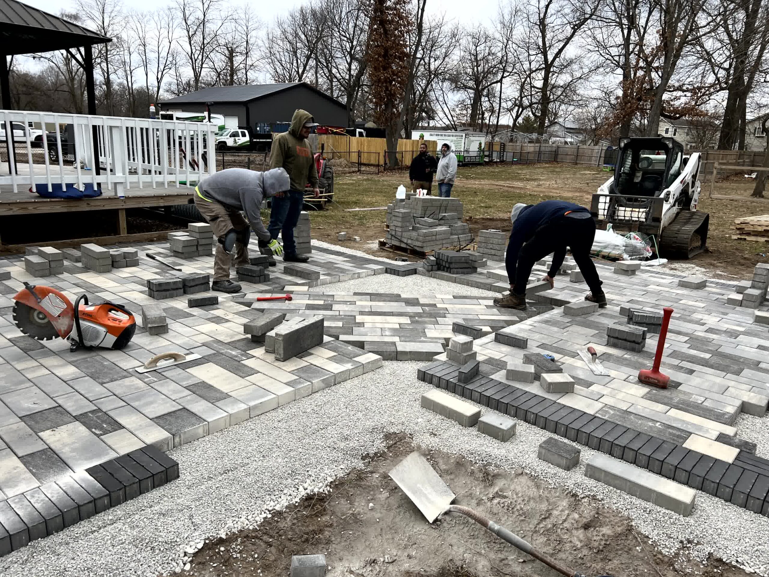 Busy Lil Beavers expert workers laying down wonderful pavers.