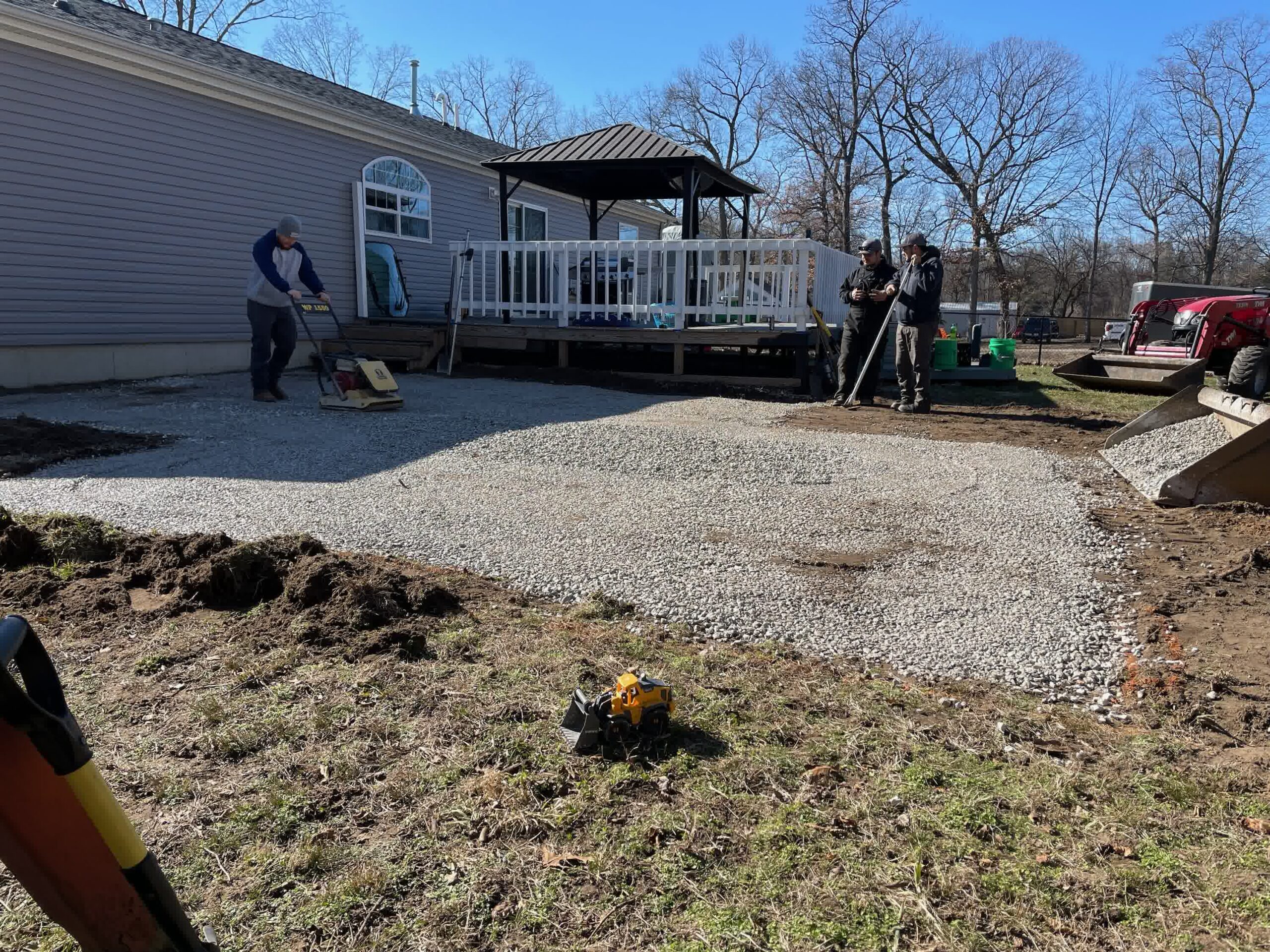 Our crew in action putting down the foundation for pavers.