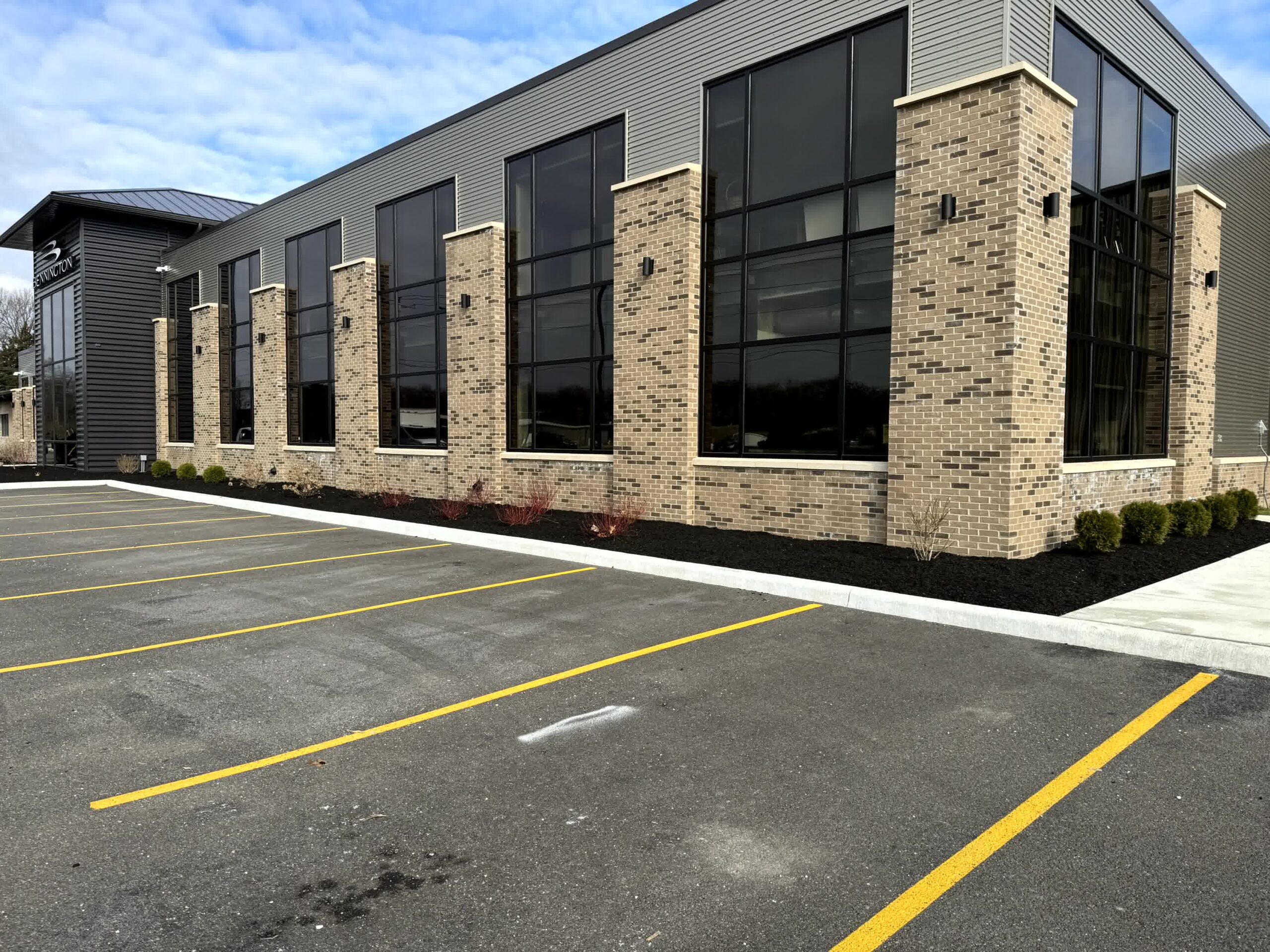 New mulch installed around a commercial business.